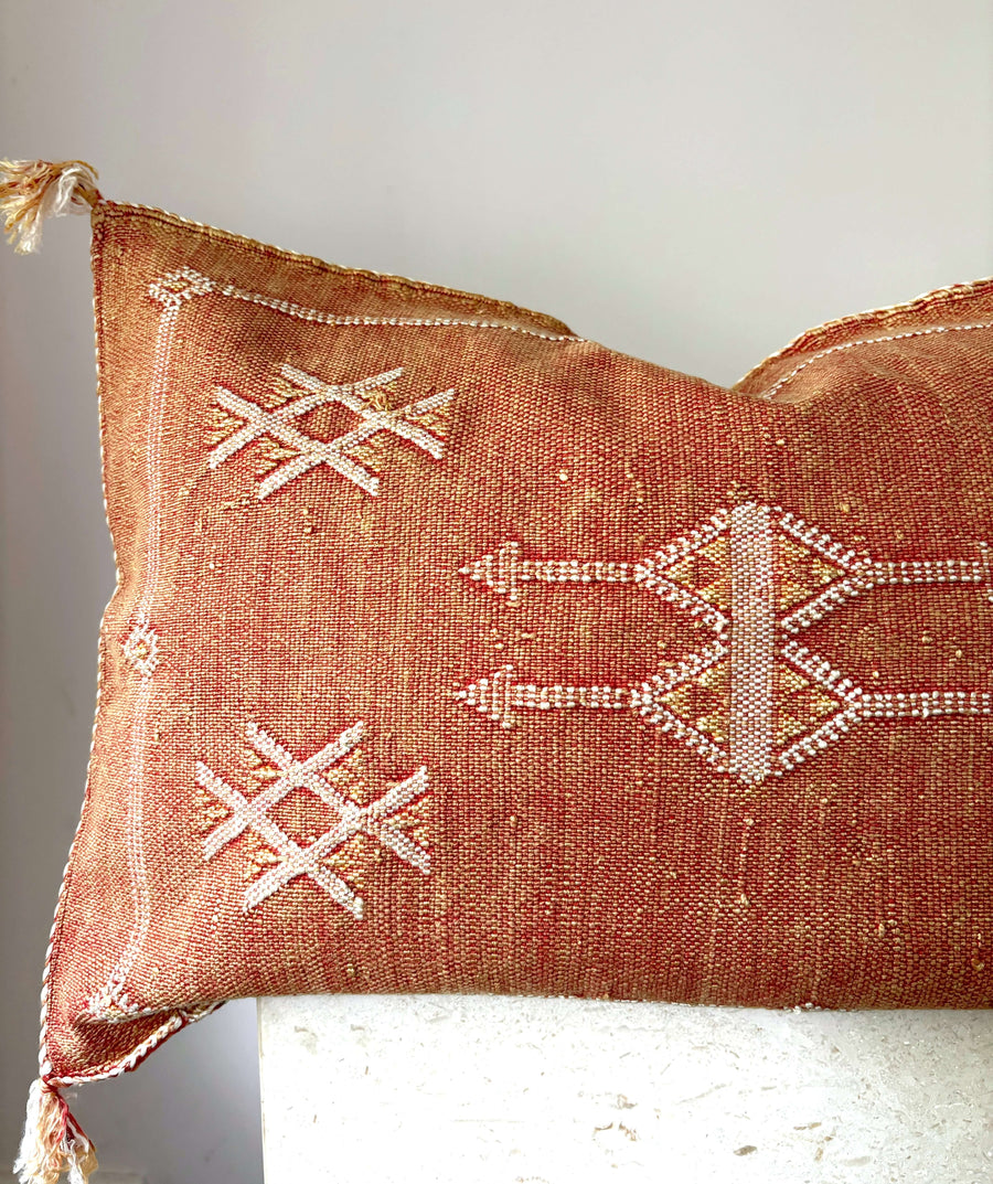 Moroccan cactus silk lumbar cushion in rust